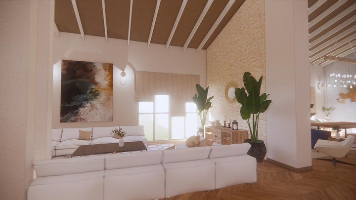 The living room looking towards a full-height stone wall, with tall indoor planting, an abstract canvas and a dining area beyond