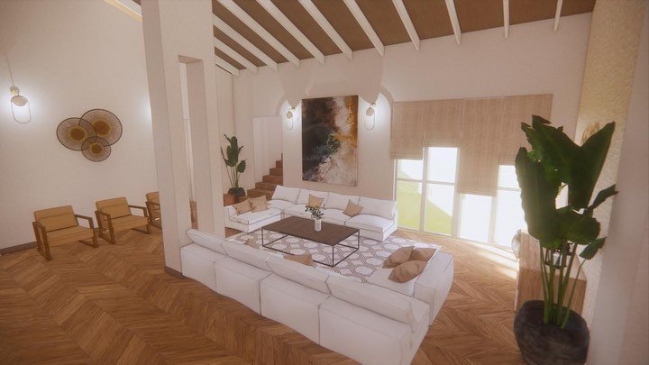 Double-height living room under exposed timber rafters, with a white modular sectional, a low black coffee table, a large abstract canvas and a staircase rising behind