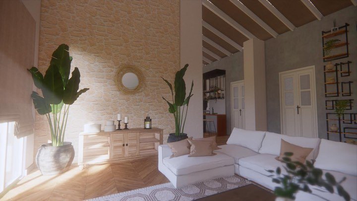 A stone feature wall with a round brass mirror above a timber sideboard, flanked by tall plants in pots
