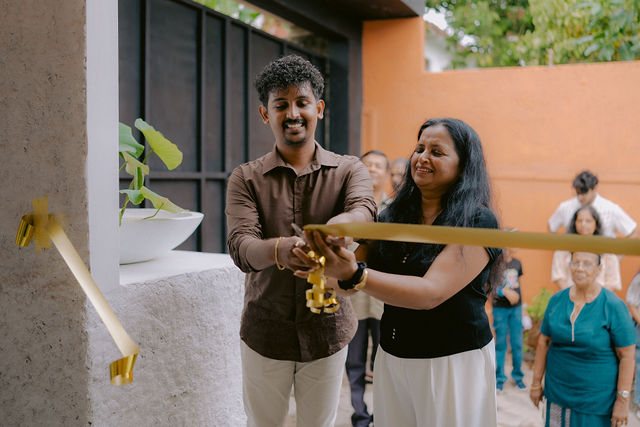 Opening day at the studio, the ribbon being cut at the entrance